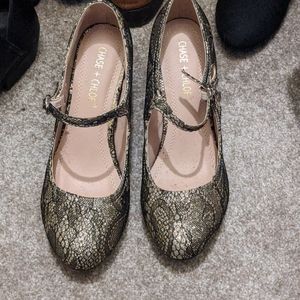 Gold and black heels